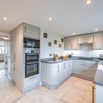 Contemporary shaker kitchen with stone worktops at Pear Tree Farm, Davenham.