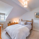 Principal bedroom with pitched ceiling and garden outlook at Pear Tree Farm, Davenham.