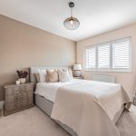 Double bedroom with neutral decor and modern finish