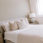 Double bedroom with neutral styling and natural light from window