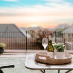 Garden patio seating with wine and sunset outlook over neighbouring homes in Hartford