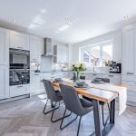 Modern kitchen with grey shaker units and integrated appliances