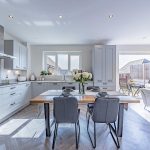 Kitchen dining space with central table and open plan layout