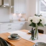 Open plan living and dining space with sofa leading through to kitchen in Hartford home