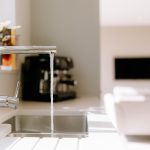 Kitchen sink and tap detail with modern fittings and worktop space