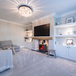 Living room with log burner and built in shelving