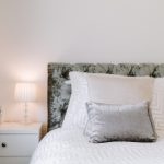 Bedroom styling detail at 211 Hartford Road, Davenham, with bedside lamp, candle and soft neutral bedding.