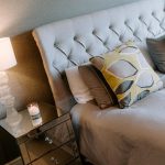 Bedroom styling detail at 39 Albemarle Avenue, Hartford, showing an upholstered headboard, patterned cushions and bedside lighting.