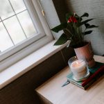 Bedroom styling detail at 39 Albemarle Avenue, Hartford, showing an upholstered headboard, patterned cushions and bedside lighting.