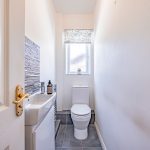 Modern ground floor cloakroom with WC and wash basin in a detached family home in Kingsmead.