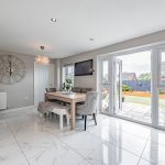 Kitchen dining room at 41 Medlock Street, Rudheath, with marble-effect tiled flooring, dining area and French doors opening to the rear garden.