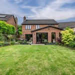 Rear elevation of this beautifully presented detached family home with bi-fold doors opening onto the landscaped garden.