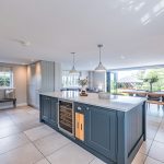 Kitchen and family space at Brooklyn Cottage in Lostock Green, designed around a large central island and sociable open-plan living.
