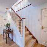Spacious entrance hall with staircase and first impressions of the home.