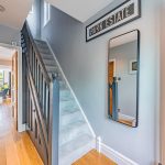 Welcoming entrance hall with oak flooring, contemporary décor and views through to the impressive open-plan living accommodation.