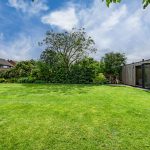 Spacious rear garden with detached garden room providing versatile space for home working, hobbies or relaxation.