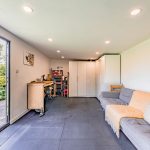 Bright and versatile garden room with contemporary finishes overlooking the mature rear garden at 219 Hartford Road, Davenham.