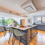 Contemporary kitchen with large central island forming the heart of this impressive open-plan family home in Davenham.