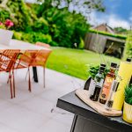 Contemporary rear terrace creating an ideal space for outdoor dining and entertaining overlooking the beautifully landscaped garden.