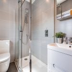 Contemporary en-suite shower room finished with large-format porcelain tiles, chrome fittings and a modern vanity unit at 31 Hartford Road, Davenham