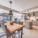 Spacious kitchen and dining area centred around a large island, creating an ideal setting for family life and entertaining at 31 Hartford Road, Davenham.
