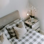 Detail of the principal bedroom highlighting the soft neutral décor and carefully styled bedside furniture at 31 Hartford Road, Davenham.