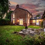 Twilight exterior of The Hollies, a four-bedroom detached character home in Moulton, Cheshire.