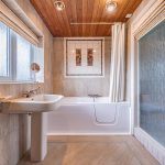 First-floor family bathroom at The Poplars, 2 Cockpit Lane, Sandiway, Northwich, with bath, pedestal basin and tiled interior.
