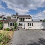 Front elevation of 25 Hadrian Way, Sandiway, with generous driveway and attached double garage.