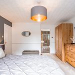 Principal bedroom with generous floor space, fitted wardrobes and access to the en suite shower room.