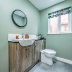 En-suite shower room serving the principal bedroom at 6 Harvest Close, Moulton