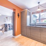 Kitchen opening into the adjoining dining area at 6 Harvest Close, Moulton